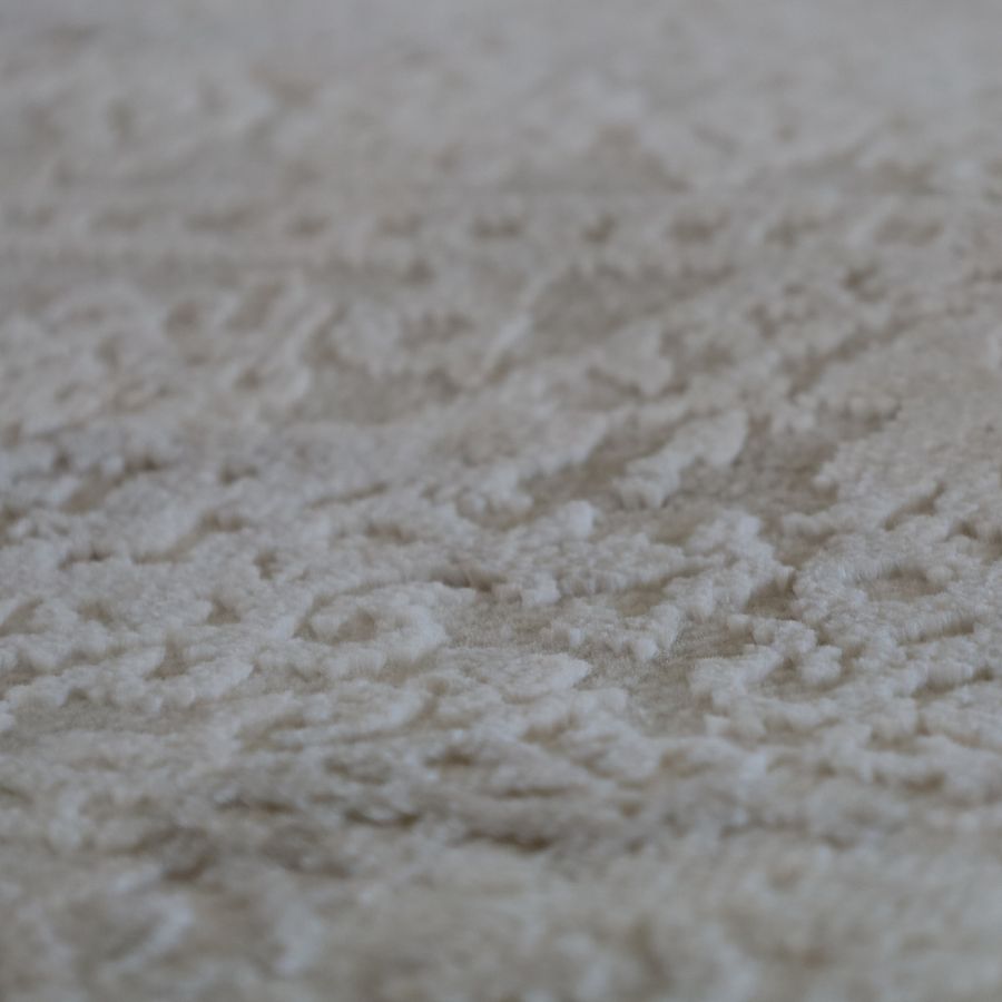Folded view of Corin Beige washable rug – compact and easy to clean – 150x210 cm – buy online in Australia