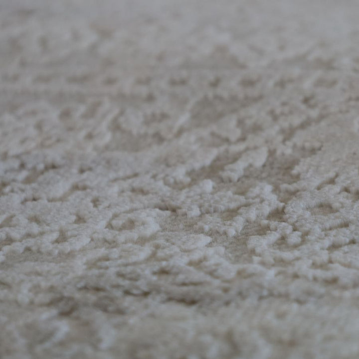 Folded view of Corin Beige washable rug – compact and easy to clean – 150x210 cm – buy online in Australia