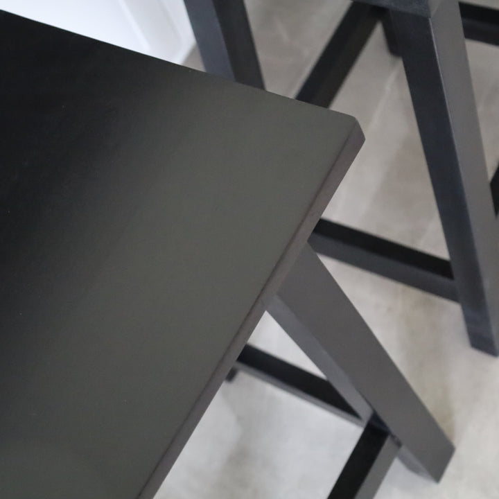 Maya black wooden stool close-up top – minimalist compact seating, buy online in Australia